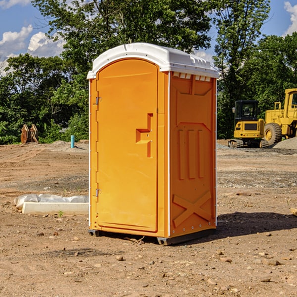 what is the cost difference between standard and deluxe portable restroom rentals in Bunch